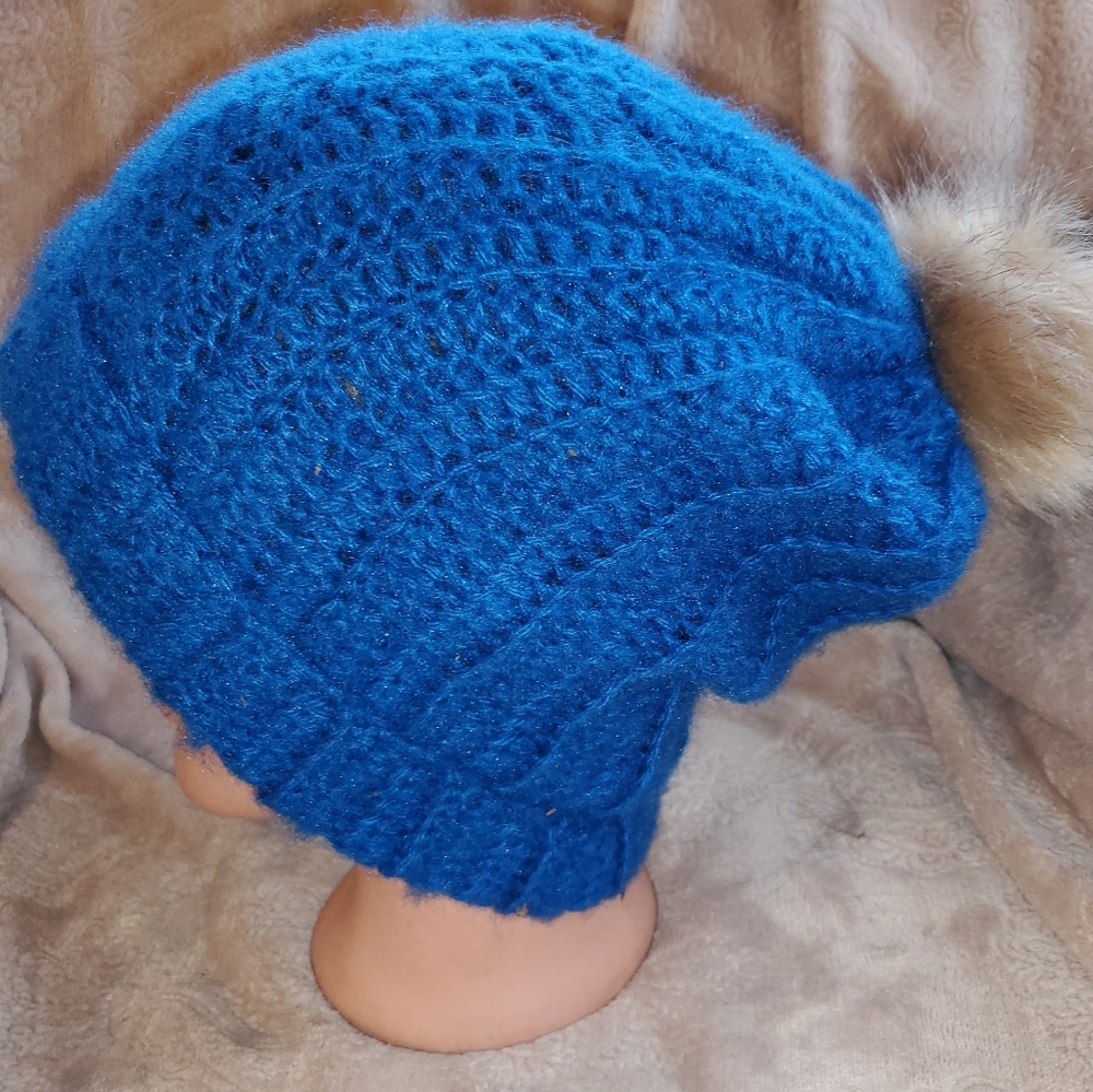 Crocheted ribbed pom pom beanie hat